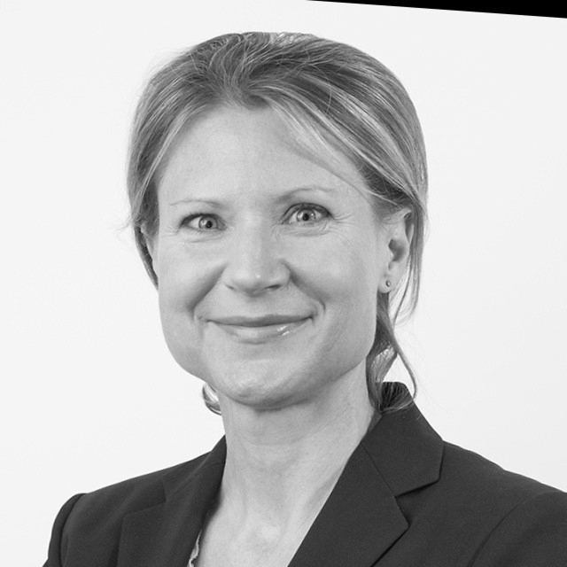 Black and white portrait of Marco Piu in a business suit